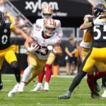 Christian McCaffery (23) had 151 yards rushing and a touchdown in the San Francisco 49ers' 30-7 win at Pittsburgh on Sunday (Photo courtesy of USATODAY.com).