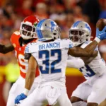 Detroit defensive back Brian Branch (32) pulls a ball in and intercepts it against Kansas City in the NFL season opener Thursday night. Branch returned the interception for a touchdown, and the Lions upset Patrick Mahomes and the Chiefs, 21-20. (Photo courtesy of DAVID EULITT / GETTY IMAGES)