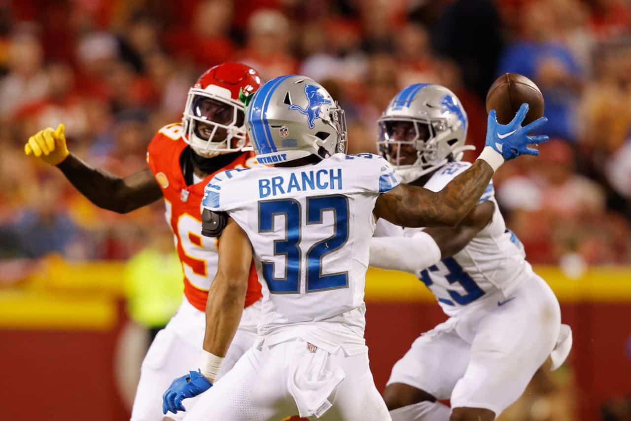 Detroit defensive back Brian Branch (32) pulls a ball in and intercepts it against Kansas City in the NFL season opener Thursday night. Branch returned the interception for a touchdown, and the Lions upset Patrick Mahomes and the Chiefs, 21-20. (Photo courtesy of DAVID EULITT / GETTY IMAGES)