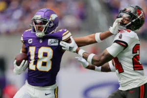 Minnesota Vikings wide receiver Justin Jefferson (left) had nine catches for 150 yards, but he and the Vikings lost to defensive back Carlton Davis (right) and the Tampa Bay Buccaneers, 20-17, on Sunday. (Photo courtesy of ADAM BETTCHER – GETTY IMAGES)