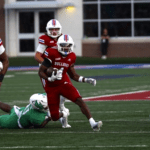 Louisiana Tech's Tyre Shelton (4, center) breaks free for yards against North Texas Saturday night in a game in Ruston, La. Shelton had 152 rush yards and a touchdown, but Tech came up short, 40-37. (Photo by ALEX NABOR)