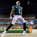 Philadelphia quarterback Jalen Hurts (above) and the Eagles will visit the New England Patriots on Sunday to open the 104th NFL season. (Photo courtesy of ESSENTIALLYSPORTS.COM)