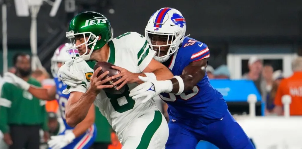 New York Jets quarterback Aaron Rodgers is sacked by Buffalo's Leonard Floyd. Rodgers was injured on the play and is believed to be out for the entire 2023 season. He had surgery Wednesday, ESPN has reported, but told friend Pat McAfee on Friday that he would return, even at 40. (Photo courtesy of BLEACHERNATION.COM)