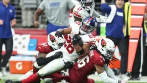 New York Giants running back Saquon Barkley (top) was injured (sprained ankle) on this play Sunday, and will miss at the very least this Thursday's game at San Francisco. The 49ers may miss wide receiver Brandon Aiyuk in the game (questionable with a shoulder injury). (Photo courtesy of BROBIBLE.COM)