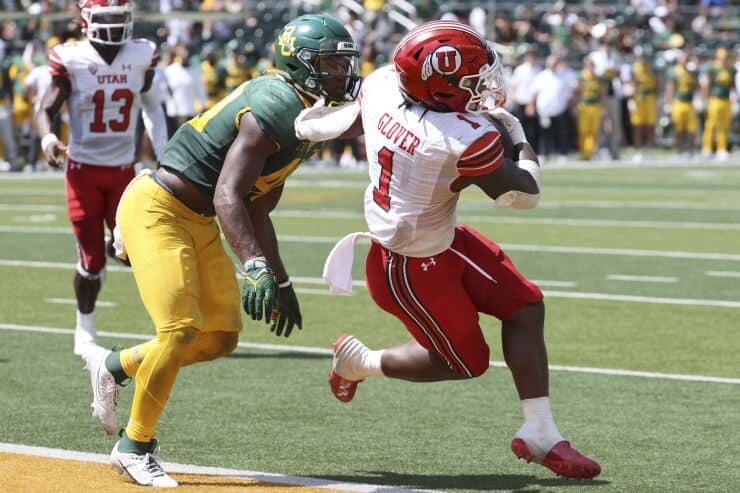 Running back Jaylon Glover (right) scores on an 11-yard touchdown for Utah to give the Utes a 20-13 win at Baylor on Saturday. (Photo couresty of DESERET.COM)