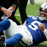 Indianapolis quarterback Anthony Richardson (above) winces in pain, after injuring his shoulder last Sunday at home against the Tennessee Titans. The Colts won the game, but lost Richardson for at least four weeks, as they put him on injured reserve on Wednesday. Garner Minshew will start in his place. (Photo courtesy of GETTY IMAGES)