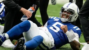 Indianapolis quarterback Anthony Richardson (above) winces in pain, after injuring his shoulder last Sunday at home against the Tennessee Titans. The Colts won the game, but lost Richardson for at least four weeks, as they put him on injured reserve on Wednesday. Garner Minshew will start in his place. (Photo courtesy of GETTY IMAGES)