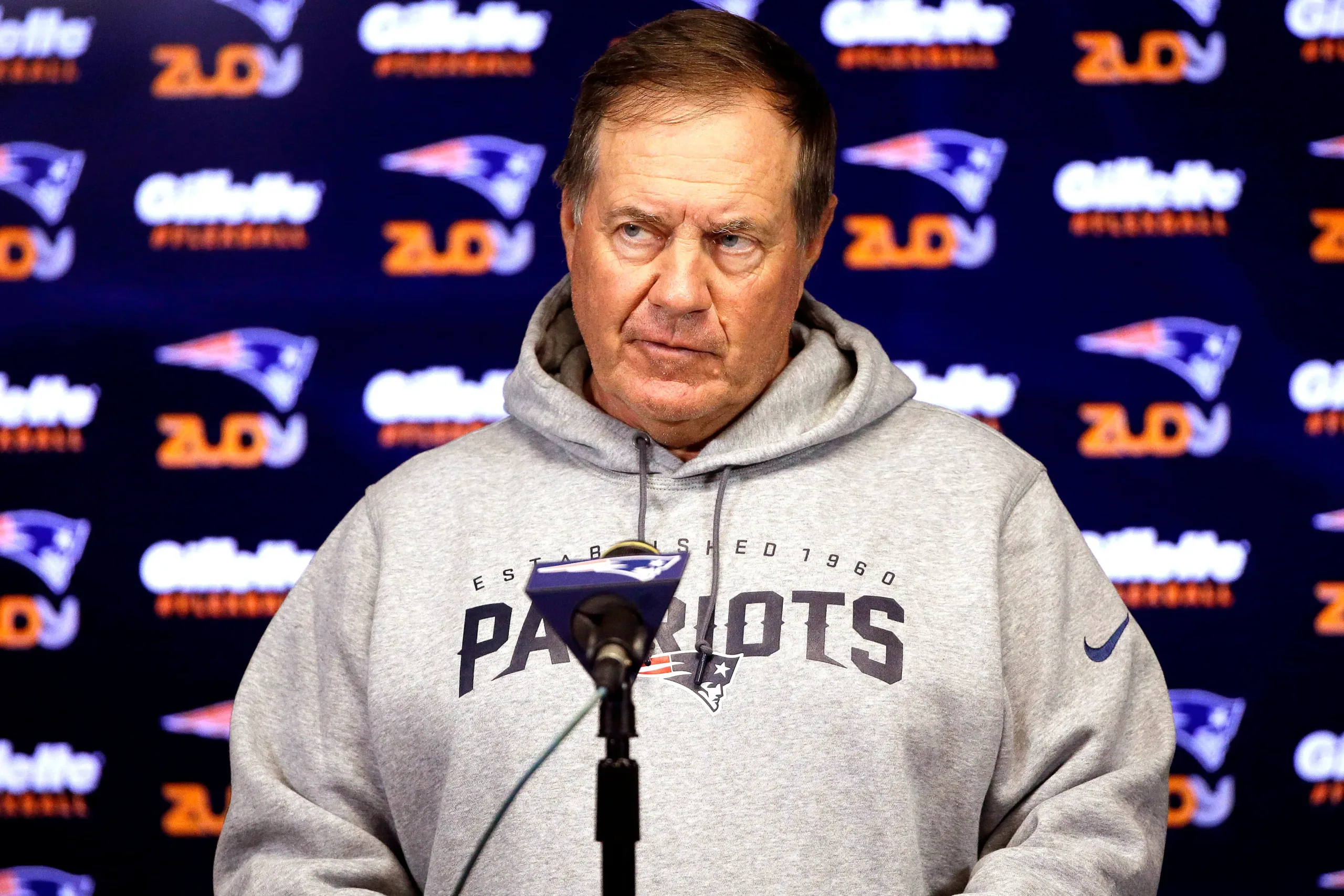 New England Patriots coach Bill Belichick (above) was defended Tuesday by his former quarterback, Tom Brady, on Brady's "Let's Go!" podcast after the Patriots' disastrous last two games, overwhelming losses at Dallas and at home to New Orleans. (Photo courtesy of NYPOST.COM)