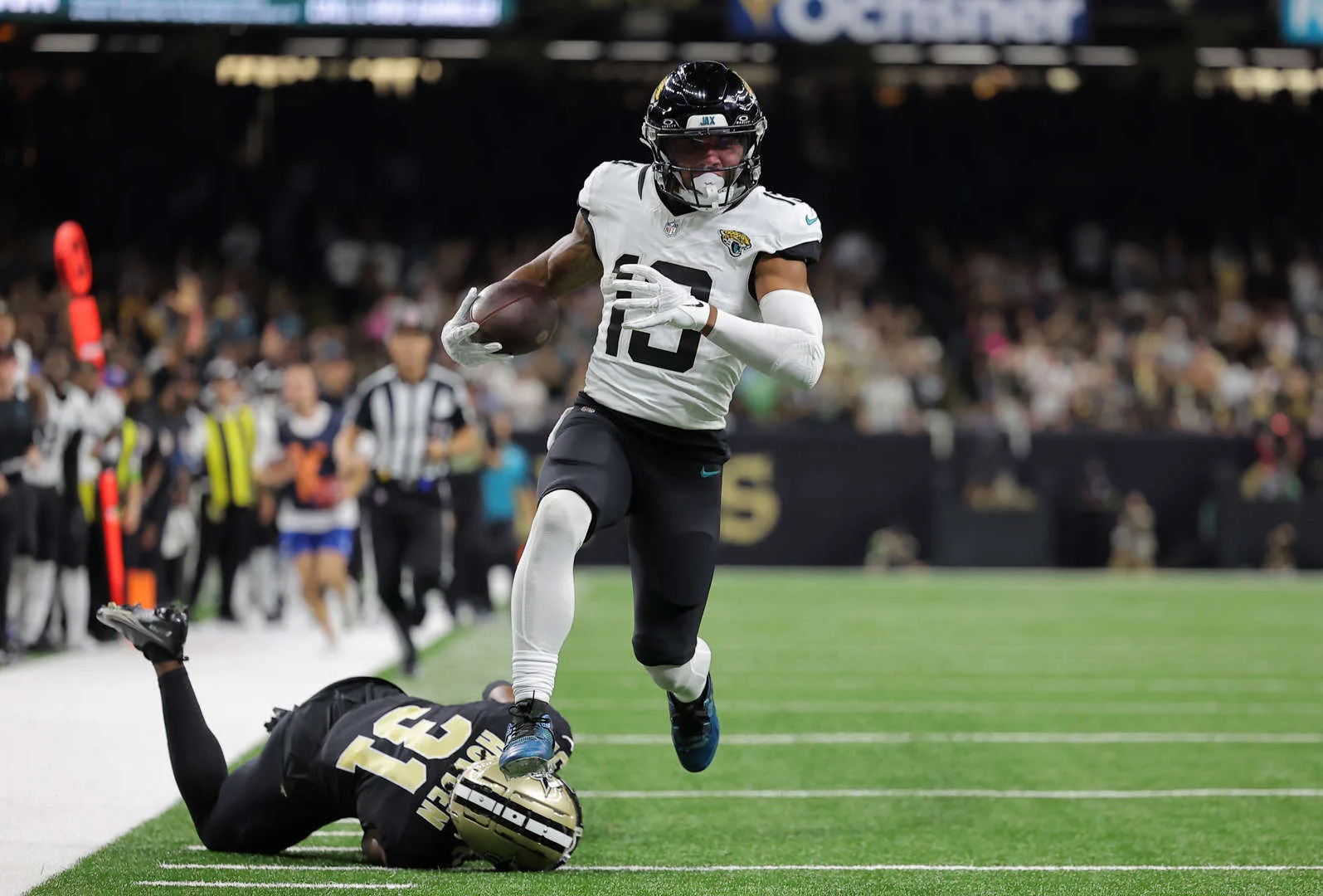 Jacksonville receiver Christian Kirk gets into the end zone on a 44-yard pass connection between himself and quarterback Trevor Lawrence, what would be the game-winner with three minutes left, allowing the Jaguars to escape from New Orleans with a 31-24 win Thursday night. (Photo by JONATHAN BACHMAN - Courtesy of GETTY IMAGES)