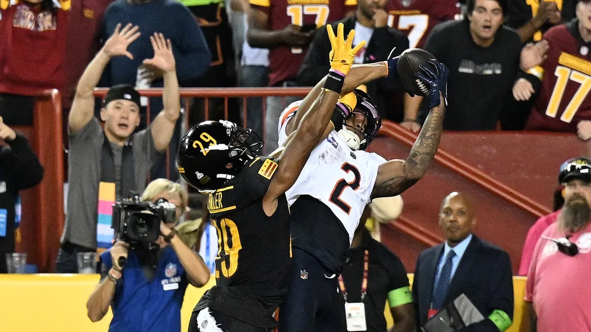 Chicago wide receiver D.J. Moore (right) hauled in eight catches for 230 yards and three touchdowns as the Bears got their first win of the season, a 40-20 win at Washington on Thursday night, just a few hours after the world was informed of the passing of iconic Chicago linebacker Dick Butkus. (Photo courtesy of PM-NEWS.NET)
