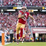 San Francisco tight end George Kittle (above) had three catches, all touchdowns, against the Dallas Cowboys in the 49ers' 42-10 win Sunday night. San Francisco and Philadelphia are both 5-0, the NFL's last two unbeaten teams this season. (Photo courtesy of SPORTS.YAHOO.COM)