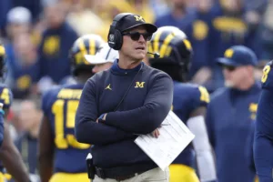 Michigan coach Jim Harbaugh (above) is in a whirlwind of controversy again, this time due to an apparent sign-stealing problem. (Photo by PAUL SANCYA - courtesy of THE ASSOCIATED PRESS)