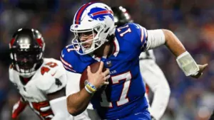 Buffalo quarterback Josh Allen (17) runs the ball against Tampa Bay on Thursday night, at home. Allen and the Bills defeated the Buccaneers, 24-18. (Photo courtesy of SPORTNEWSCENTER.COM)