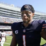 Chicago Bears quarterback Justin Fields (1) leaves Soldier Field after a 31-28 loss to Denver, a game the Bears led by three scores. Fields and the Bears visit Washington tonight, a 7 p.m. start. (Photo by NAM Y. HUH - Courtesy of THE ASSOCIATED PRESS)