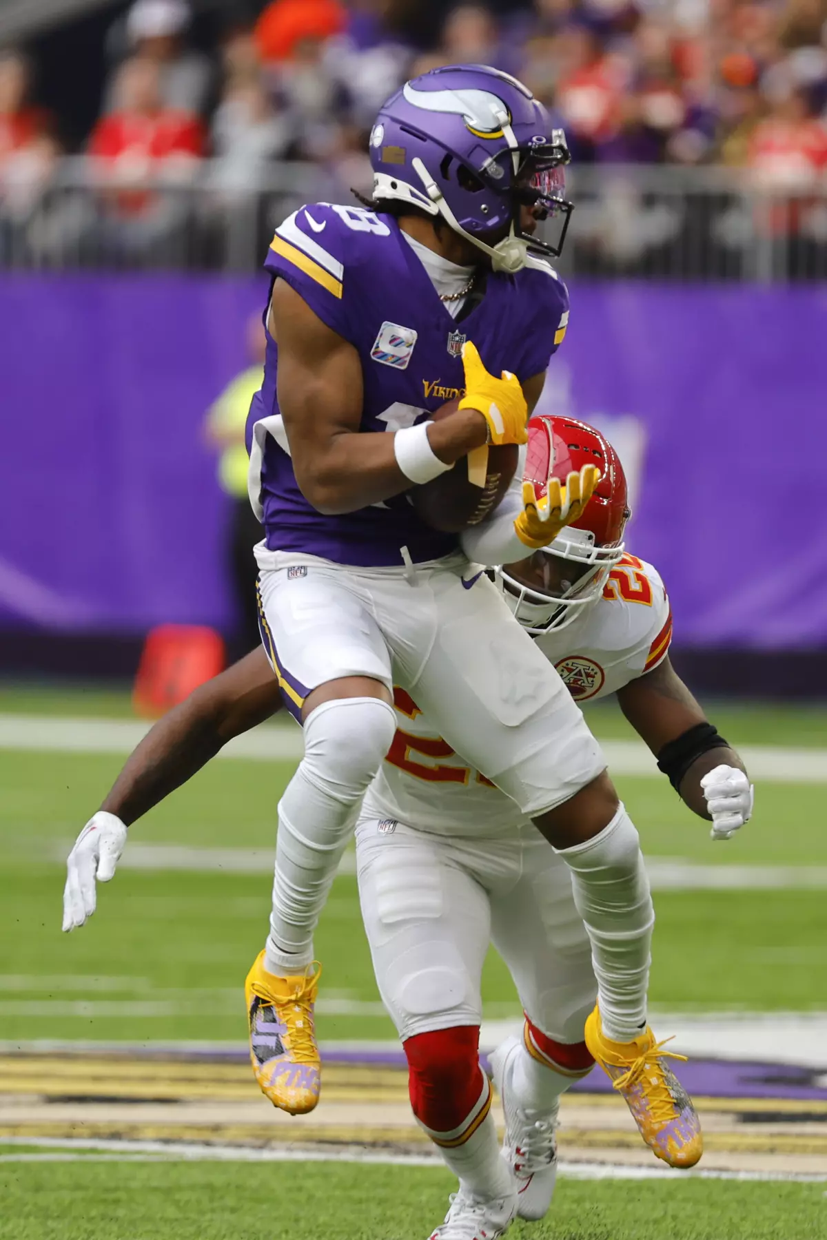 Minnesota Vikings receiver Justin Jefferson (foreground) makes a catch Sunday against Kansas City safety Justin Reid. But Jefferson left the game in the fourth quarter with a strained hamstring, one that will now require him to be placed on injured reserve. (Photo by BRUCE KLUCKHOHN, courtesy of THE ASSOCIATED PRESS)