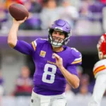 Minnesota Vikings quarterback Kirk Cousins (shown here against Kansas City last Sunday) has been the subject of trade speculation in the national sports media for the last week. Cousins says he's oblivious of it, and is focused on the Vikings' next opponent: Chicago, this Sunday. (Photo courtesy of YAHOO! SPORTS)