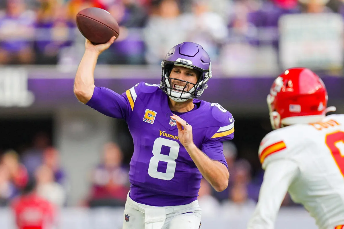 Minnesota Vikings quarterback Kirk Cousins (shown here against Kansas City last Sunday) has been the subject of trade speculation in the national sports media for the last week. Cousins says he's oblivious of it, and is focused on the Vikings' next opponent: Chicago, this Sunday. (Photo courtesy of YAHOO! SPORTS)