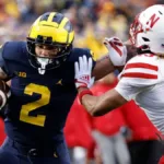 Michigan running back Blake Corum (left) had two touchdowns Saturday in a 52-7 win over Indiana. (Photo courtesy of CBSSPORTS.COM)