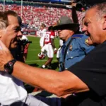 Alabama coach Nick Saban (left) is congratulated by Arkansas coach Sam Pittman after Alabama's 24-21 win on Saturday, Saban's 200th win as coach of the Crimson Tide. (Photo courtesy of USATODAY.COM)