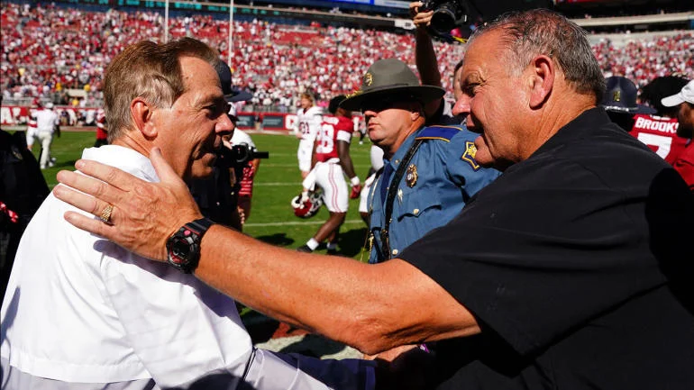 Alabama coach Nick Saban (left) is congratulated by Arkansas coach Sam Pittman after Alabama's 24-21 win on Saturday, Saban's 200th win as coach of the Crimson Tide. (Photo courtesy of USATODAY.COM)