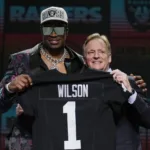 The Las Vegas Raiders picked defensive end Tyree Wilson (above, left, with NFL Commissioner Roger Goodell) very early in the 2023 NFL Draft. But Wilson, and other members of the Raiders' draft class haven't gone wild with improvement. (Photo by JEFF ROBERSON, Courtesy of the Associated Press)