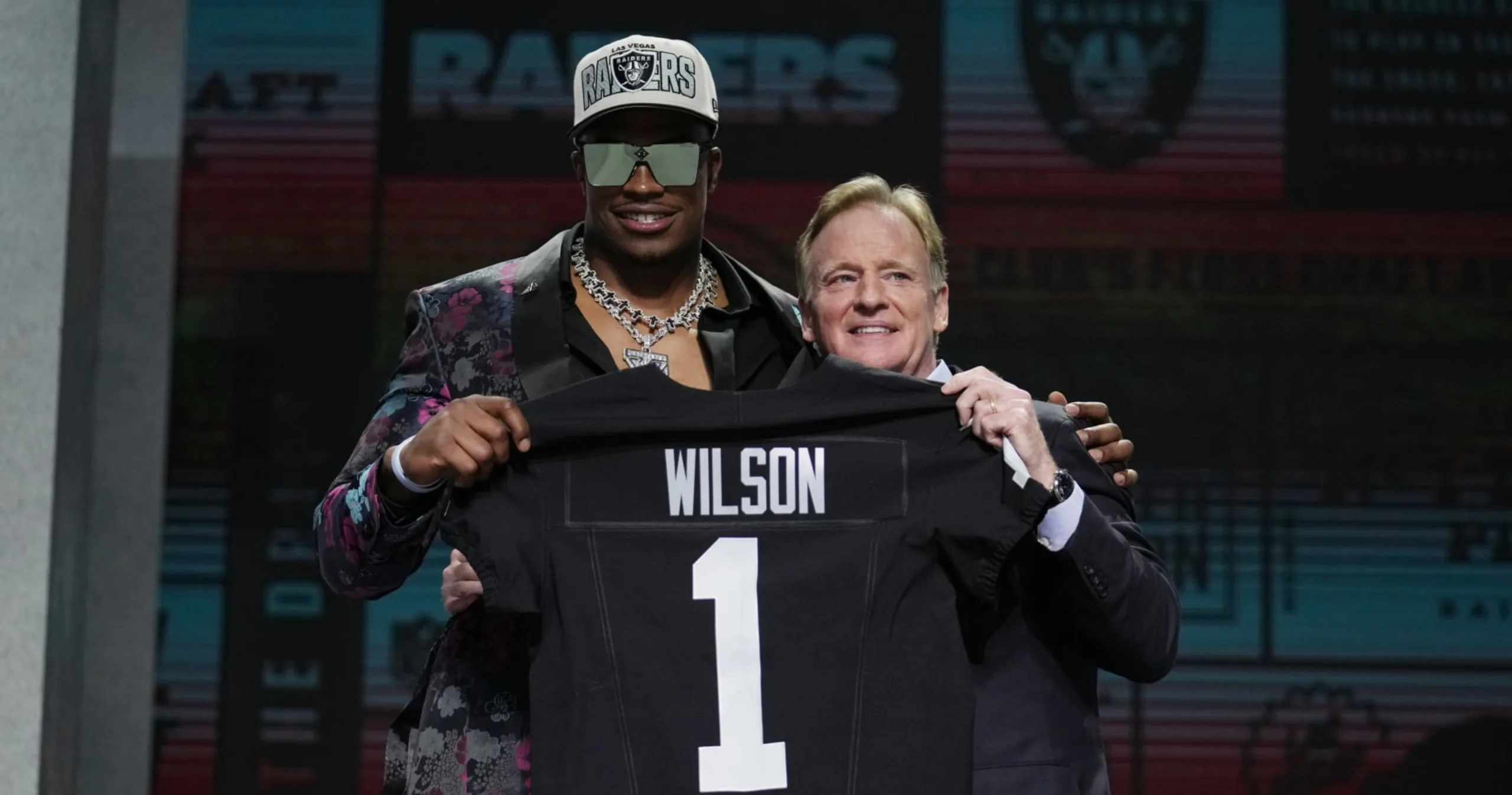 The Las Vegas Raiders picked defensive end Tyree Wilson (above, left, with NFL Commissioner Roger Goodell) very early in the 2023 NFL Draft. But Wilson, and other members of the Raiders' draft class haven't gone wild with improvement. (Photo by JEFF ROBERSON, Courtesy of the Associated Press)