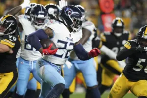 Tennessee Titans running back Derrick Henry (above) is shown here against the Pittsburgh Steelers. The Steelers got the win at home Thursday night, 20-16. (Photo courtesy of THE ASSOCIATED PRESS)