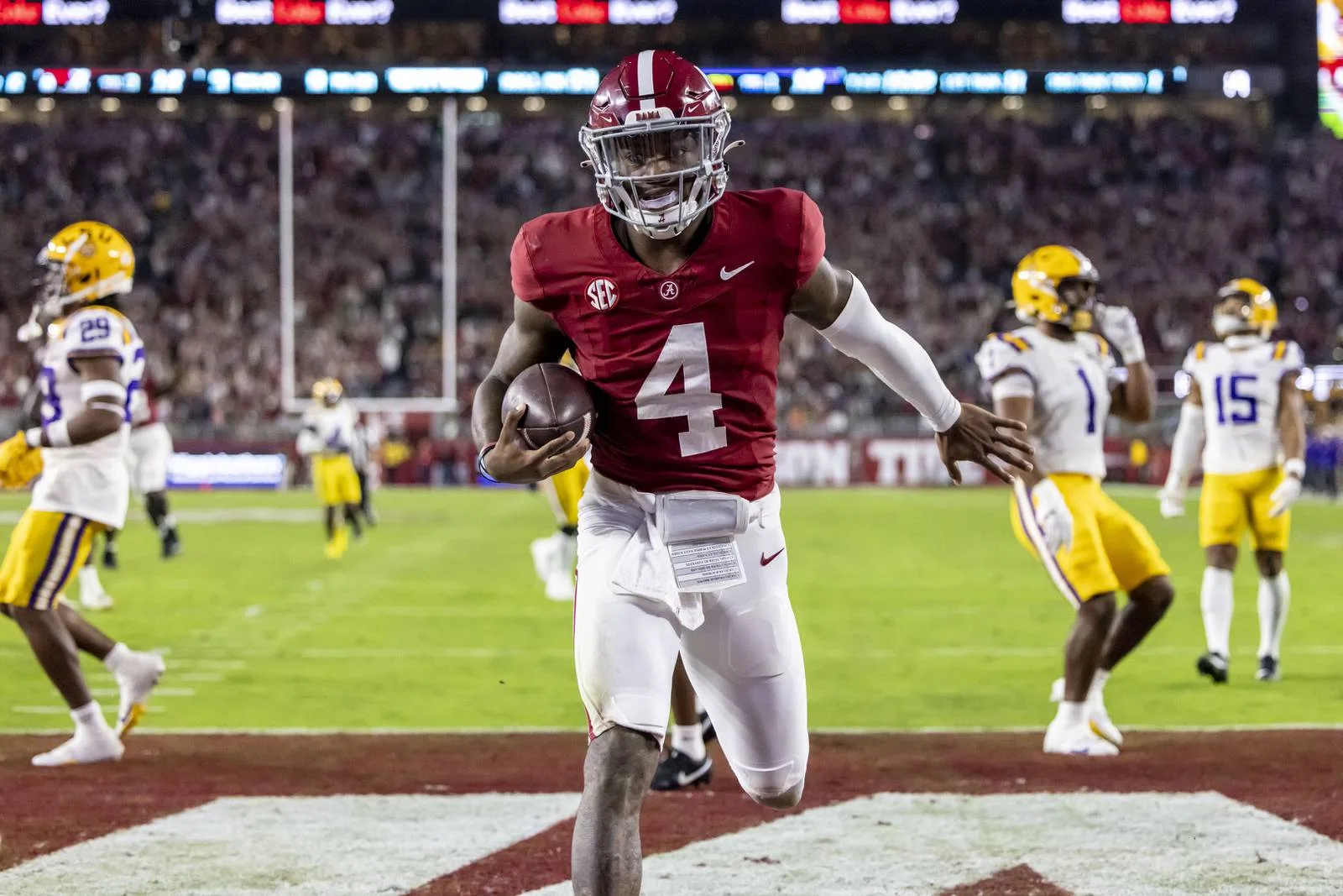 Alabama quarterback Jalen Milroe (4) scores against LSU on Saturday, Nov. 4, in Tuscaloosa. Milroe ran for 155 yards and four touchdowns in the 42-28 Alabama win. (Photo courtesy of THE ASSOCIATED PRESS)