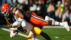 Cleveland Browns defensive end Myles Garrett (top) against the Pittsburgh Steelers last Sunday. Garrett leads the NFL in sacks, and is our choice for the AFC Defensive Player of the Year Award-winner at just over the midpoint of the season. (Photo courtesy of FOX NEWS)