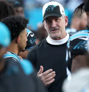Carolina owner David Tepper (not pictured) has dismissed head coach Frank Reich (right), pictured here with quarterback Bryce Young. (Photo courtesy of CA.NEWS.YAHOO.COM)