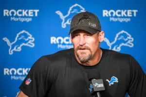 Detroit Lions coach Dan Campbell talks with the media. Campbell returns to Dallas, where he once played, to face the Cowboys on Saturday night in an important NFC game. (Photo courtesy of BROBIBLE.COM)