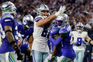 Jake Ferguson (center) of the Dallas Cowboys signals first down after a catch against Seattle on Thursday night. Ferguson wound up making a catch for the game-winning score to give the Cowboys a 41-35 win, their 14th straight at home. (Photo courtesy of OURMIDLAND.COM)