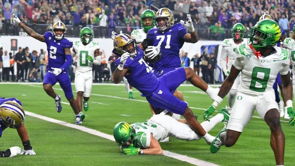 Washington running back Dillon Johnson (7) dives into the end zone against Oregon n the Pac-12 Championship Game in Las Vegas Friday night. Washington would hold on for a 34-31 win, and is 13-0 this season. The Huskies appear to be headed for the College Football Playoff when the committee announces it on Sunday morning. We'll see. (Photo by BRIAN ROTHMULLER, Courtesy of GETTY IMAGES)