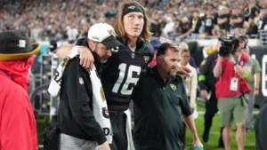Jacksonville quarterback Trevor Lawrence (center) suffered what was diagnosed as a high ankle sprain last Monday against Cincinnati; the Jaguars hope Lawrence can start Sunday at Cleveland. (Photo courtesy of THE SPORTING NEWS)