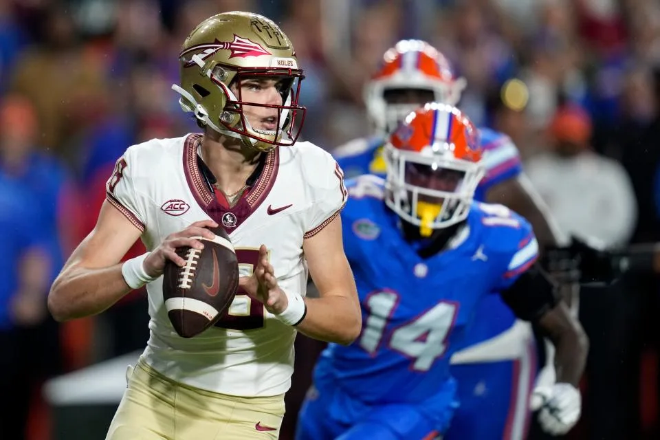 Florida State is losing quarterback Tate Rodemaker (foreground) to the transfer portal; Rodemaker won't play in this week's Orange Bowl against Georgia. (Photo courtesy of YAHOO! SPORTS)