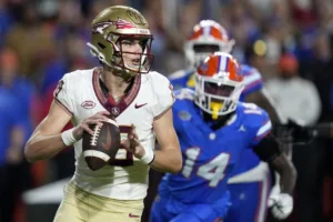 Florida State quarterback Tate Rodemaker (above, left) is questionable for Saturday's ACC Championship Game against Louisville, one the Seminoles (12-0) have to win to get into the College Football Playoff. (Photo courtesy of YAHOO! SPORTS)
