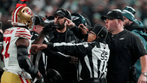 San Francisco linebacker Dre Greenlaw (left) gets into a shouting match with Philadelphia Eagles head of security Dom DiSandro (far right) during the game between the two franchises on Sunday afternoon. Both men were ejected, and the 49ers went on to win the game, 42-19. (Photo courtesy of WPXI.COM)