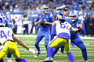 Detroit Lions quarterback Jared Goff (center) looks for a target against the Los Angeles Rams during an NFC wild-card game Sunday evening. Detroit won, 24-23, the franchise's first playoff win since the 1991 season. (Photo by DUANE BURLESON - Courtesy of THE ASSOCIATED PRESS)