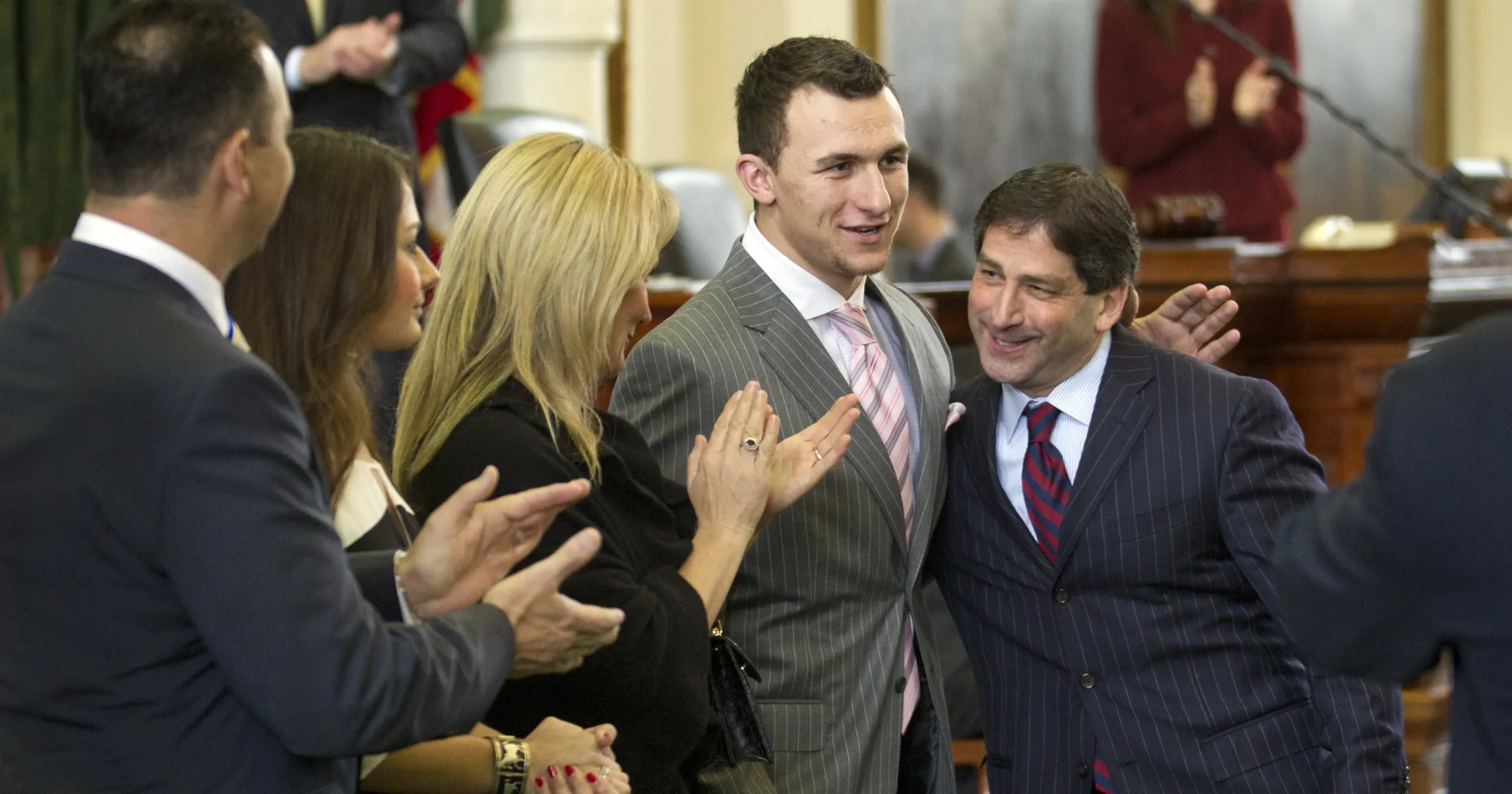 Former Texas A&M quarterback and Heisman Trophy winner Johnny Manziel (second from right) says he'll avoid attending the Heisman Trophy ceremony until former winner Reggie Bush is welcomed back. Bush had his Heisman honors stripped from him by the trust and the NCAA following NCAA violations. (Photo courtesy of USATODAY.COM)
