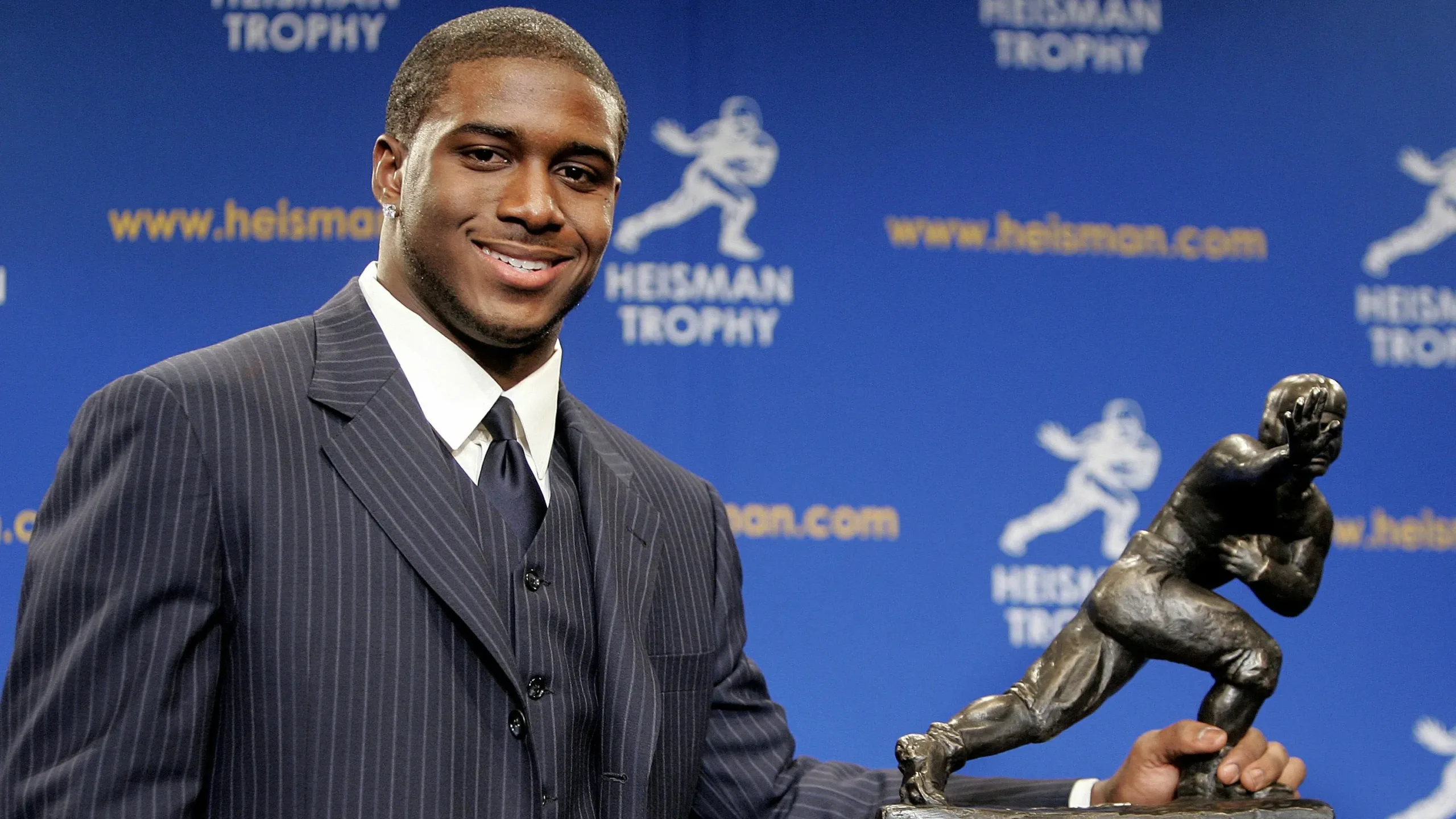 Former Southern Cal running back and Heisman Trophy winner Reggie Bush and his Heisman have been reunited, 14 years after it was removed from him, and the university, for NCAA violations. (Photo courtesy of USATODAY.COM)