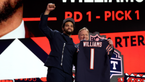Caleb Williams, the No. 1 overall pick of the 2024 NFL Draft, poses with his Chicago Bears jersey, held up by Commissioner Roger Goodell. Chicago coach Matt Eberflus announced Friday, in a complete shocker (sarcasm), that Williams will be the Bears' starter from the get-go this season. (Photo courtesy of BROBIBLE.COM)