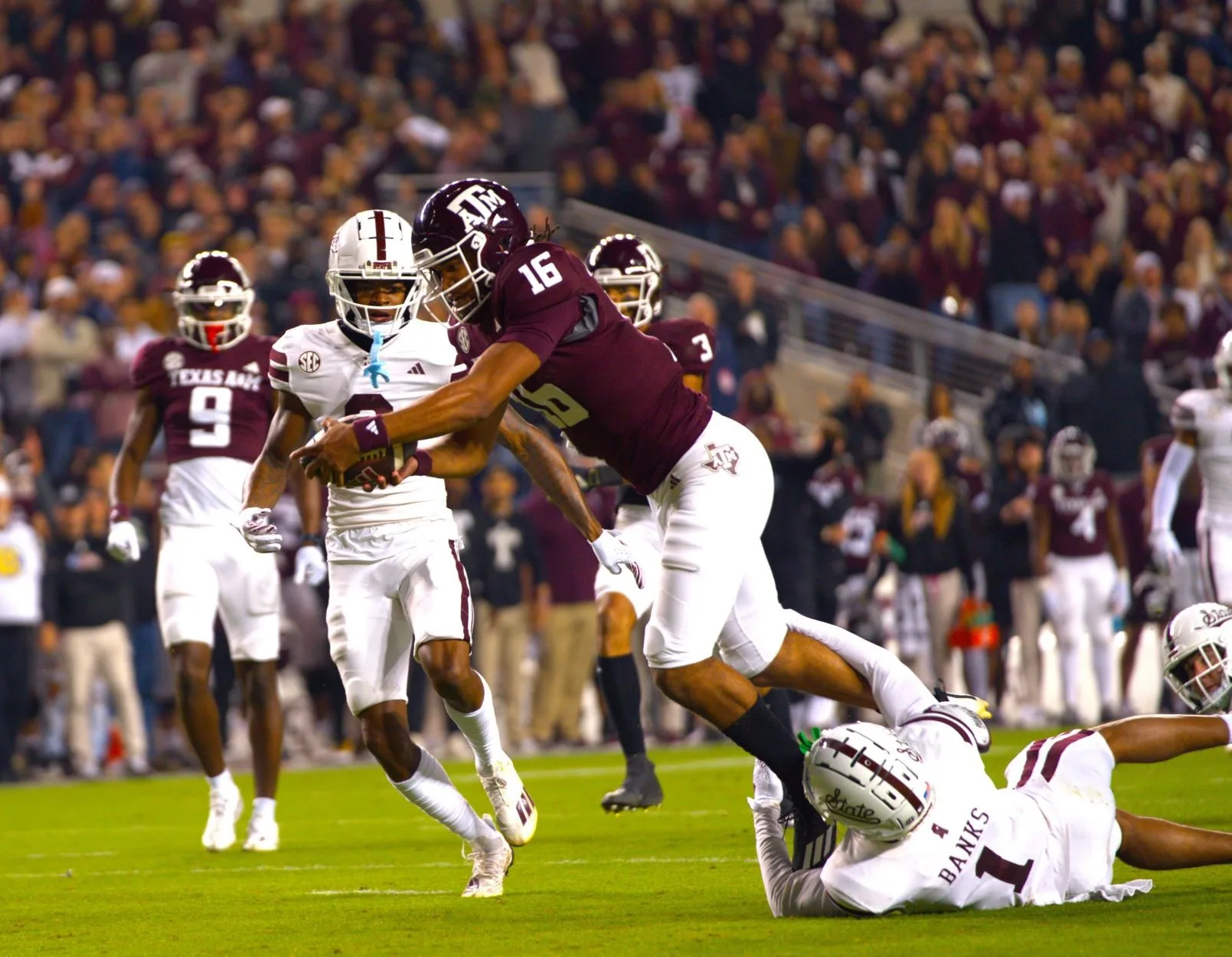 Texas A&M quarterback Jaylen Henderson (foreground) scores against Mississippi State in this photo, in what would be the final game for coach Jimbo Fisher in College Station. The Southeastern Conference on Thursday released kickoff times and the TV schedule for the first three weeks of the season, and several other games of note, such as the Florida-Georgia game, the Egg Bowl between Mississippi State and Ole Miss, Georgia and Georgia Tech's annual battle, and the SEC Championship Game. (Photo by ALEX NABOR - THE FOOTBALL BEAT)
