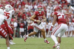 Oklahoma first-year starter Jackson Arnold threw four touchdown passes in his debut, as a lot of Sooners debuted in a rare Friday night game, a 51-3 win over Temple to open the 2024 season, OU's first in the Southeastern Conference. (Photo by ALONZO ADAMS / THE ASSOCIATED PRESS)