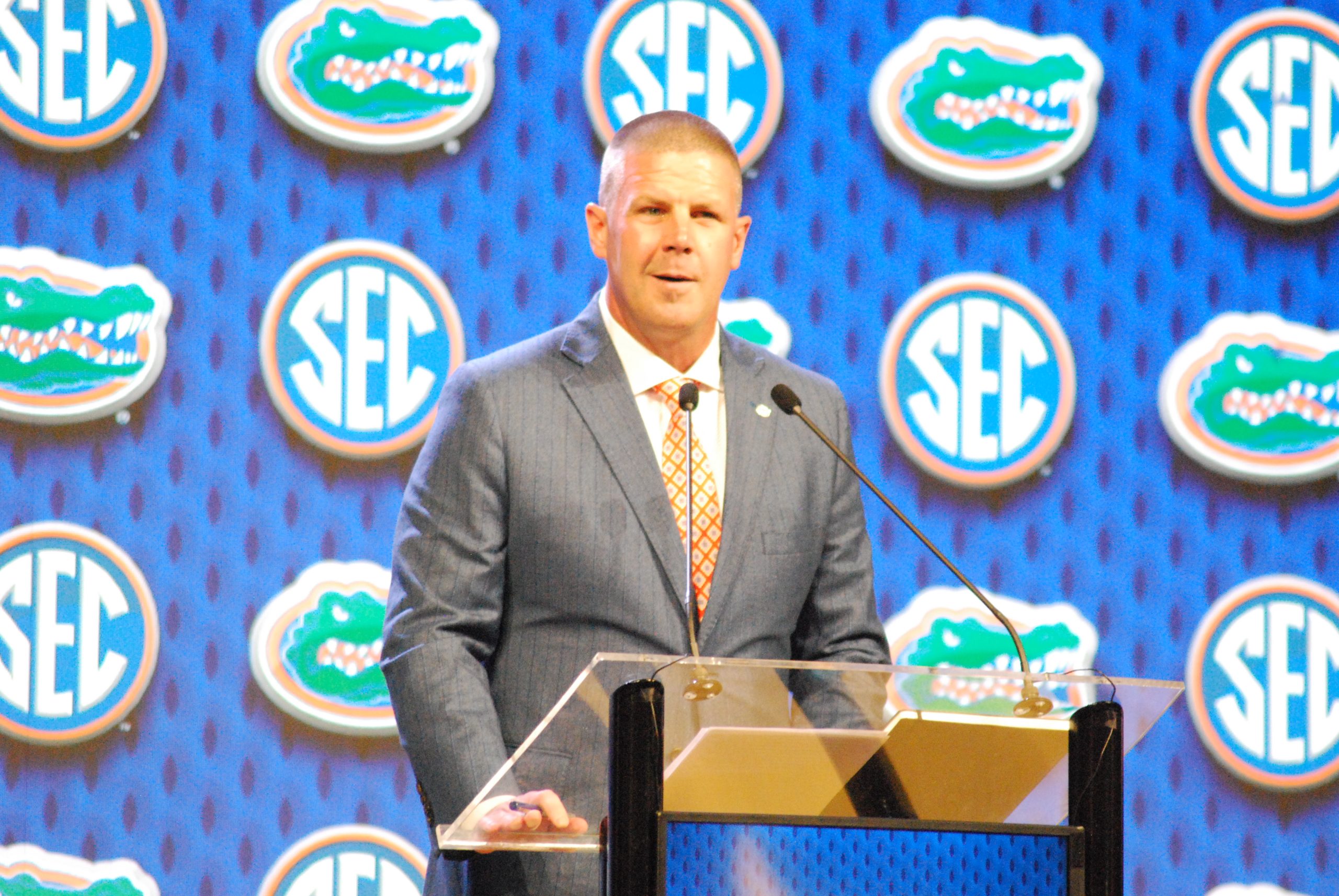 Florida coach Billy Napier (above) lost his season opener to Miami, and he also doesn't know that homes in Florida don't have basements. So, his tenure as the Gators' coach is over, according to ESPN's Mike Greenberg (inset). (Photo above by VIRGINIA HAGLER-LUCAS - THE FOOTBALL BEAT; photo below courtesy of THE SPUN)