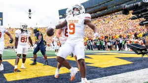 Texas' Jerrick Gibson scores on Michigan on Saturday, an eventual 31-12 win for the Longhorns over the defending national champion Wolverines. (Photo by AARON J. THORNTON, courtesy of GETTY IMAGES)